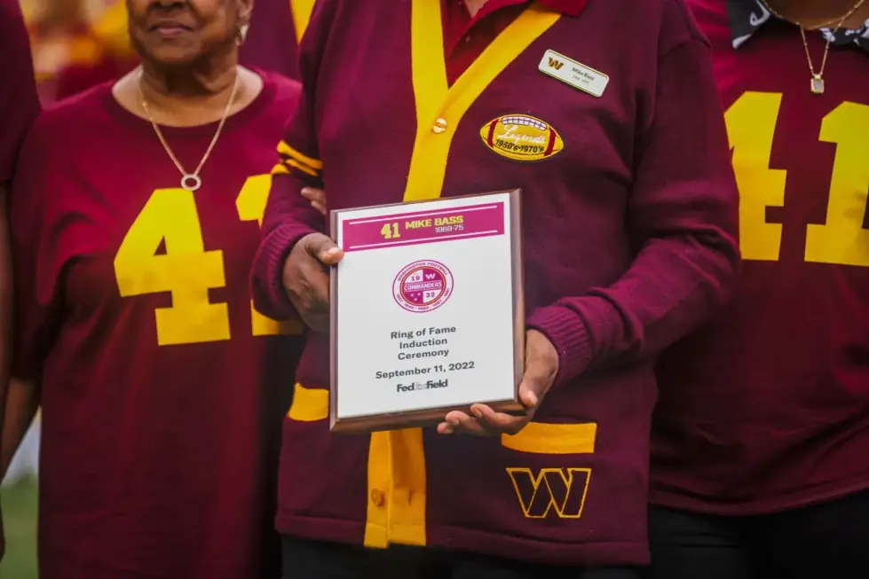 Hands holding the Ring of Fame plaque: 41 Mike Bass 1969-75, Ring of Fame Induction Ceremony, September 11, 2022, FedExField